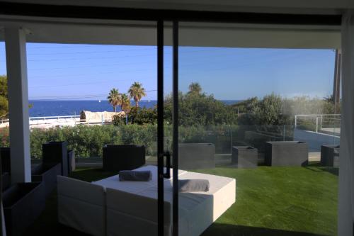 a living room with a view of the ocean at VILLA MIAMI in Les Issambres