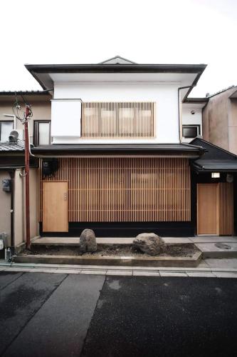 a building with a building with at Modern Machiya MIBU in Kyoto