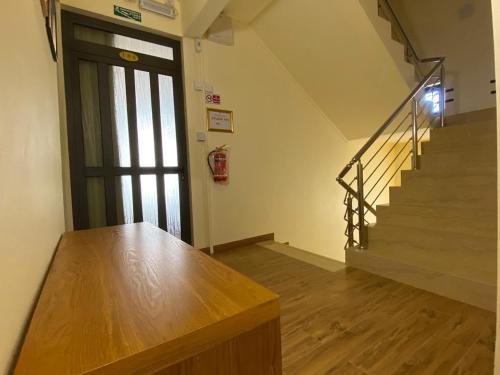 an empty room with a door and stairs in a building at The Monalysa Suites & Residence in Grand Baie