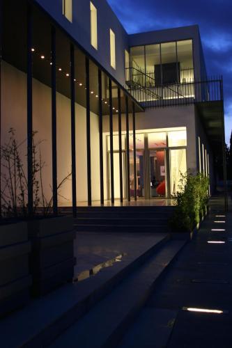 a large building with lights on the side of it at Hotel Villa Didon Carthage in Carthage