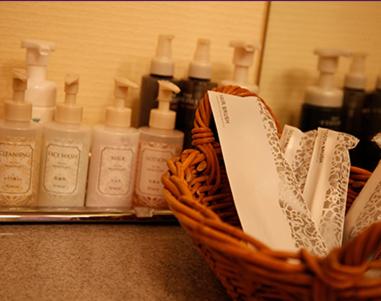 a basket full of bottles of soap on a counter at HOTEL K's GOMANGOKU adult only 