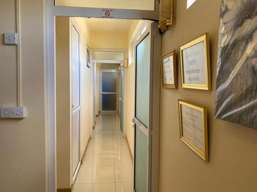 a corridor of a hallway with at Monalysa St Honore Apartment & Studios Grand Bay in Grand Baie