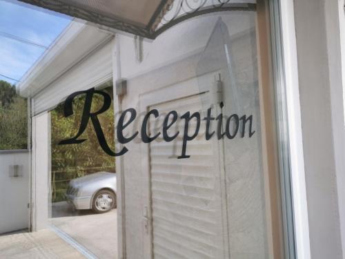 a reflection of a car in the window of a garage at Villa Boho Cherga in Belgrade