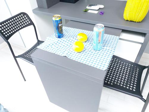 a table with two lemons and two soda cans on it at ARA Palace Hotel in Jeju