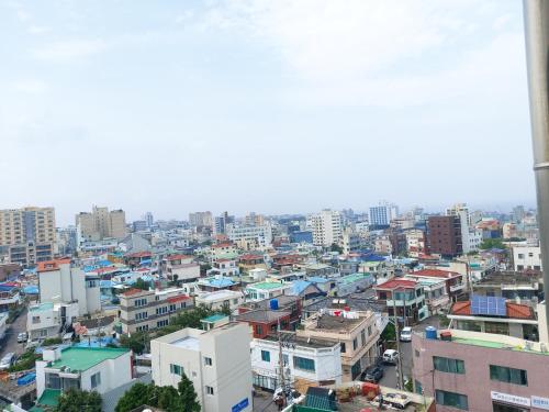 a city view of a city with buildings at ARA Palace Hotel in Jeju