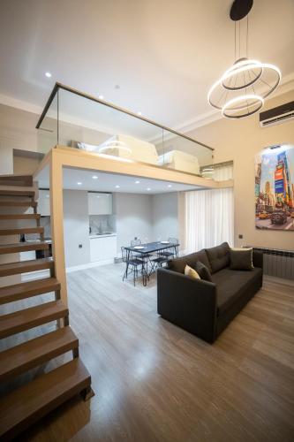 a living room with a couch and a table at Prime Suites Bulvar in Baku