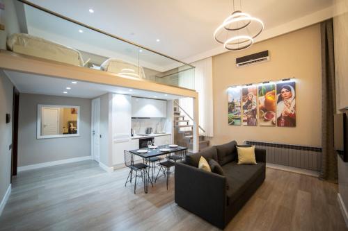 a living room with a couch and a table at Prime Suites Bulvar in Baku