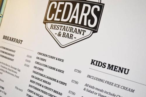 a menu for the cedars restaurant and bar at Mablethorpe Static Holiday Home in Mablethorpe
