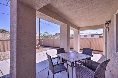 a patio with a table and chairs on a porch at Inviting Retreat with Patio Less Than 1 Mi to Colorado River in Bullhead City