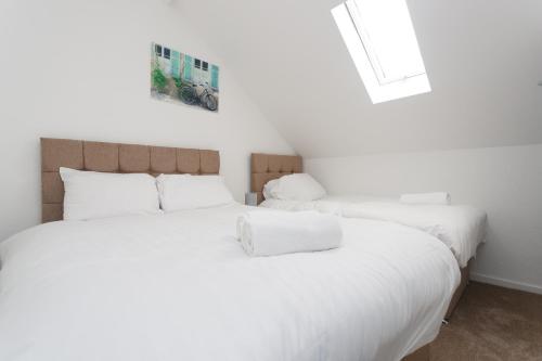 Кровать или кровати в номере Kirkstall House