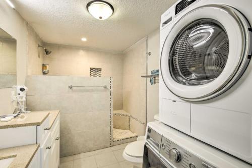 a bathroom with a washing machine on the wall at Updated Ybor City House with Fenced Yard in Tampa