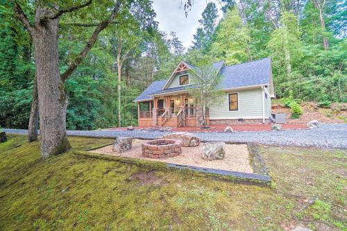 a house with a fire pit in the yard at Hootenanny at Horton Creek Creekside Escape! in Helen
