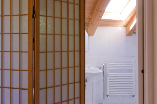a bathroom with a toilet and a sink at Schloss-Castel Pienzenau - Guestrooms & Apartments - B&B-Hotel & Restaurant in Merano