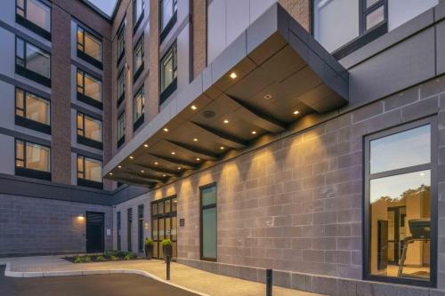 a building with awnings on the side of it at Holiday Inn Express - Boston Logan Airport - Revere by IHG in Revere