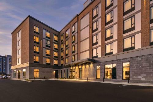 a rendering of a building with lights on at Holiday Inn Express - Boston Logan Airport - Revere by IHG in Revere