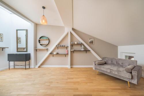 a living room with a couch and a table at Design Apartments - "Villa Arnim" in Potsdam
