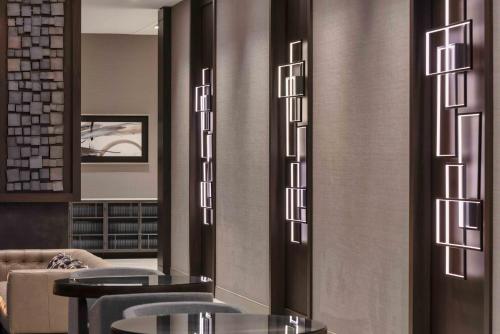 a restaurant with tables and chairs in a room at Holiday Inn Express - Boston Logan Airport - Revere by IHG in Revere