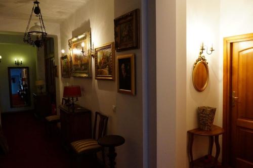 a hallway with pictures on the walls of a house at Willa Marysin in Maków Podhalański