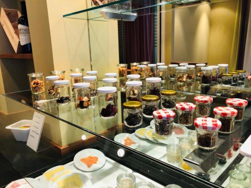 a display case with many different types of desserts at Hotel Felmis in Luzern