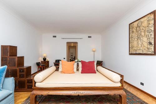 a living room with a couch with pillows on it at Amazing New Penthouse with terrace Jewish Ghetto in Rome