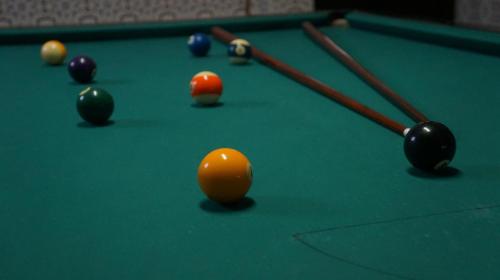 a group of billiard balls on a pool table at Residencial Ponto Certo in Vilar Torpim