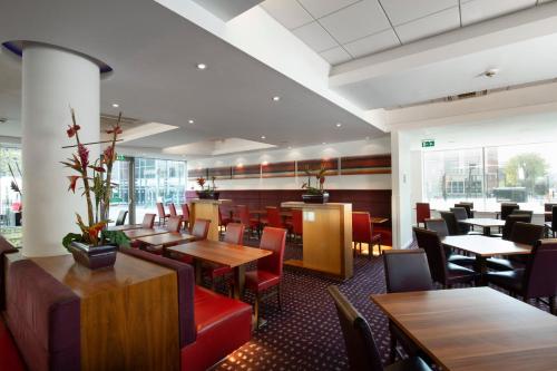 a large dining room with a large window at Holiday Inn Express Newcastle City Centre, an IHG Hotel in Newcastle upon Tyne