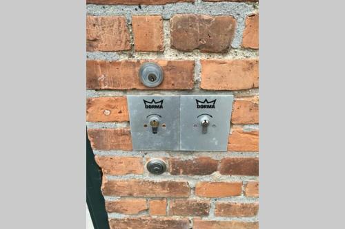 an electrical outlet on a brick wall at Sundbyvestervarehus in Copenhagen