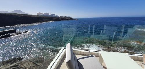 a glass house with a view of the ocean at Stunning Sea View FREE WIFI in Callao Salvaje