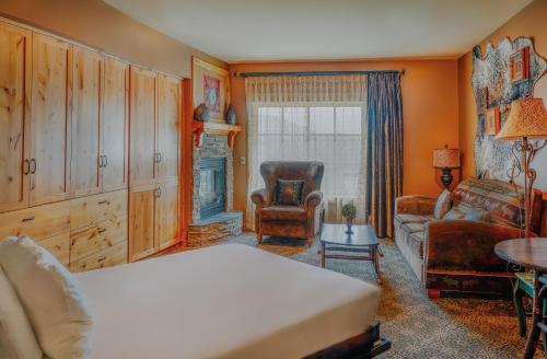 a bedroom with a bed and a living room at Big Sky Resort Village Center in Big Sky