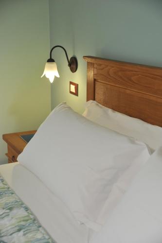 Postel nebo postele na pokoji v ubytování AFFITTACAMERE LA MAGIA DEI COLORI