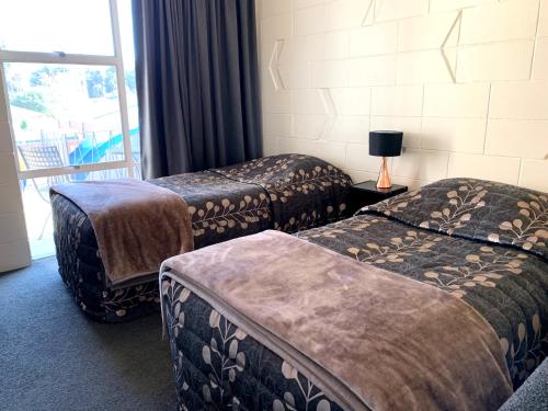 Säng eller sängar i ett rum på Temuka Motel