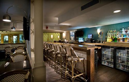 a bar with chairs and a counter in a restaurant at Ocean Escape Condos in Myrtle Beach