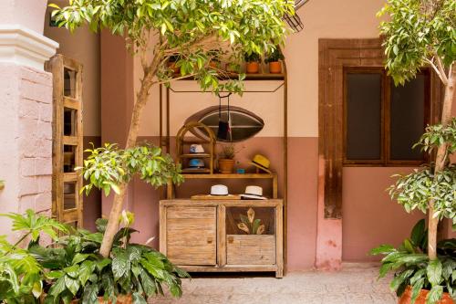 a room with trees and a wooden cabinet at Selina San Miguel de Allende in San Miguel de Allende