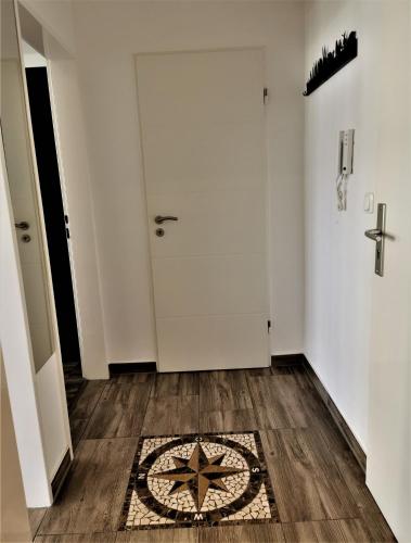 a room with a door and a rug on the floor at Bremen City in Bremen