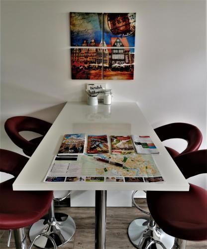 a white table with a magazine on top of it at Bremen City in Bremen