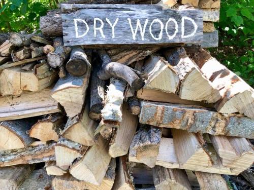 a pile of wood with a sign on it at The Craftsman Farmhouse with Modern Flair in Bethlehem