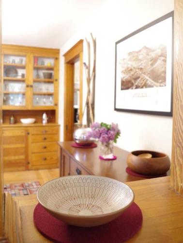 a kitchen with a table with a bowl on top of it at The Craftsman Farmhouse with Modern Flair in Bethlehem