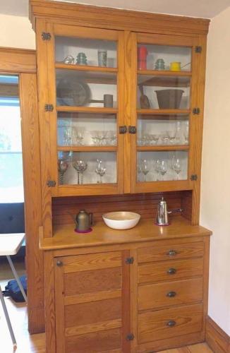 a wooden cabinet with a sink in a room at The Craftsman Farmhouse with Modern Flair in Bethlehem