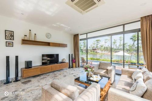 Posezení v ubytování BOM HOMES - Flamigo Dai Lai Resort CBT