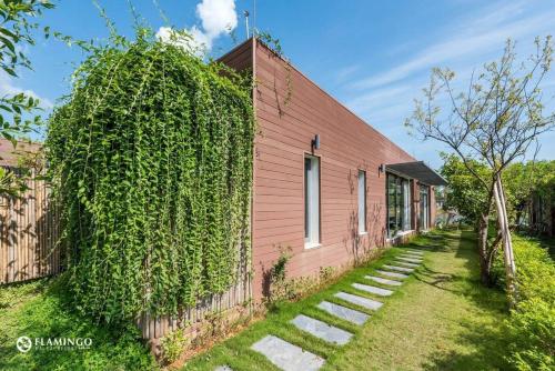 Zahrada ubytování BOM HOMES - Flamigo Dai Lai Resort CBT