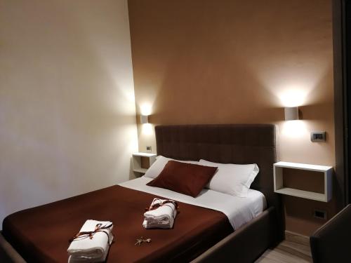 Ένα ή περισσότερα κρεβάτια σε δωμάτιο στο B&B Elisir