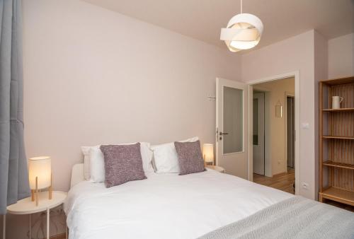Giường trong phòng chung tại 3 bed modern family house in Mikulov
