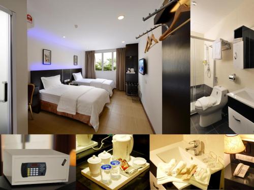 una camera d'albergo con letto e bagno di E-Red Hotel Bayu Mutiara a Bukit Mertajam