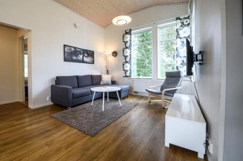 a living room with a couch and a table at Östersunds Camping in Östersund