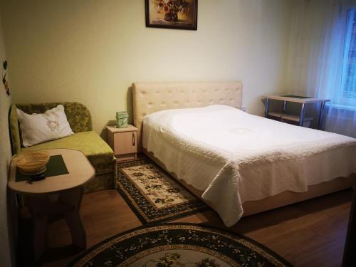 Un pat sau paturi într-o cameră la Sadyba Anzhelika