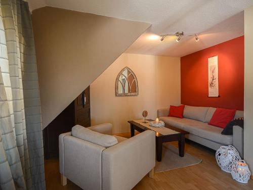 a living room with a couch and a table at ABACCO Ferienwohnungen in Überlingen