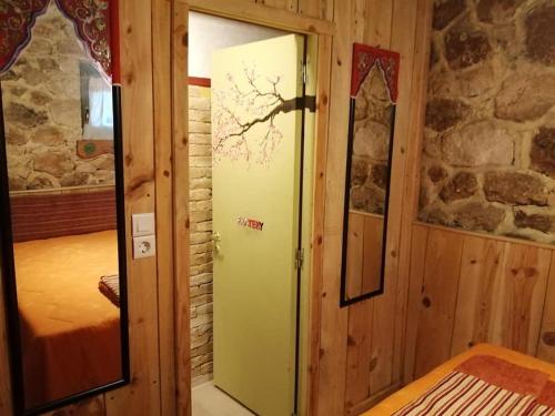 a room with a door to a bedroom with a bed at Yono's Traditional House in Ano Ravenia