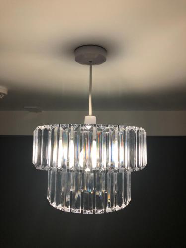a hanging glass chandelier hanging from a ceiling at Al Forno Restaurant & Inn in Norwich
