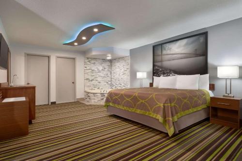 A bed or beds in a room at Super 8 by Wyndham Windsor/Dougall