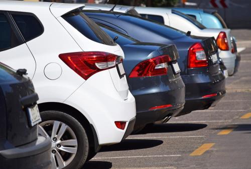 a row of parked cars in a parking lot at Clayton Hotel, Manchester Airport in Hale